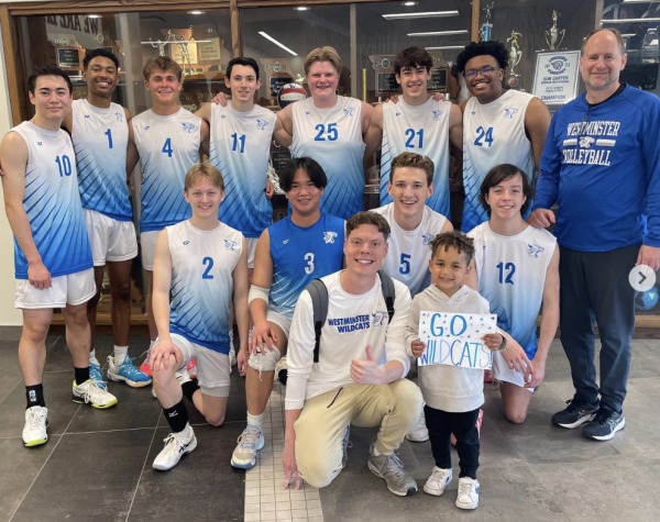 Boys Volleyball gathers after a win